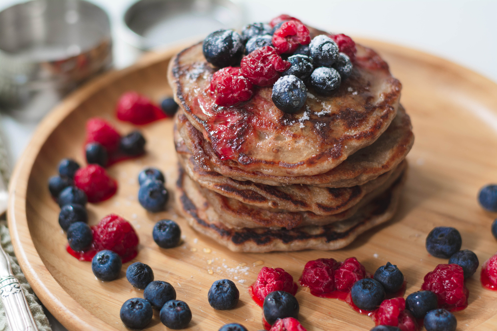 Pancakes with fresh fruit and a touch of maple syrup.