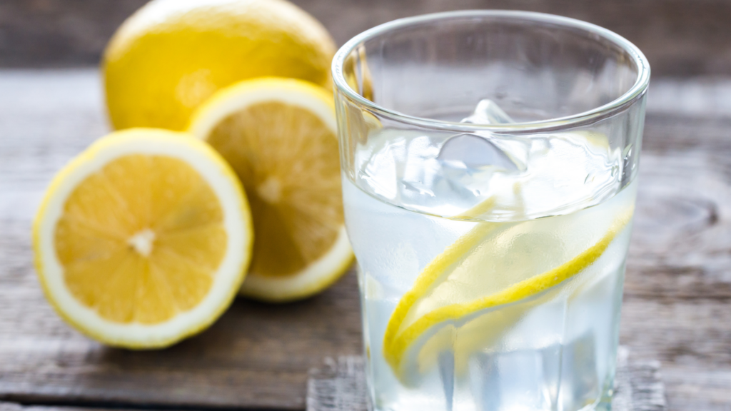 A picture of a glass of water with a lemon